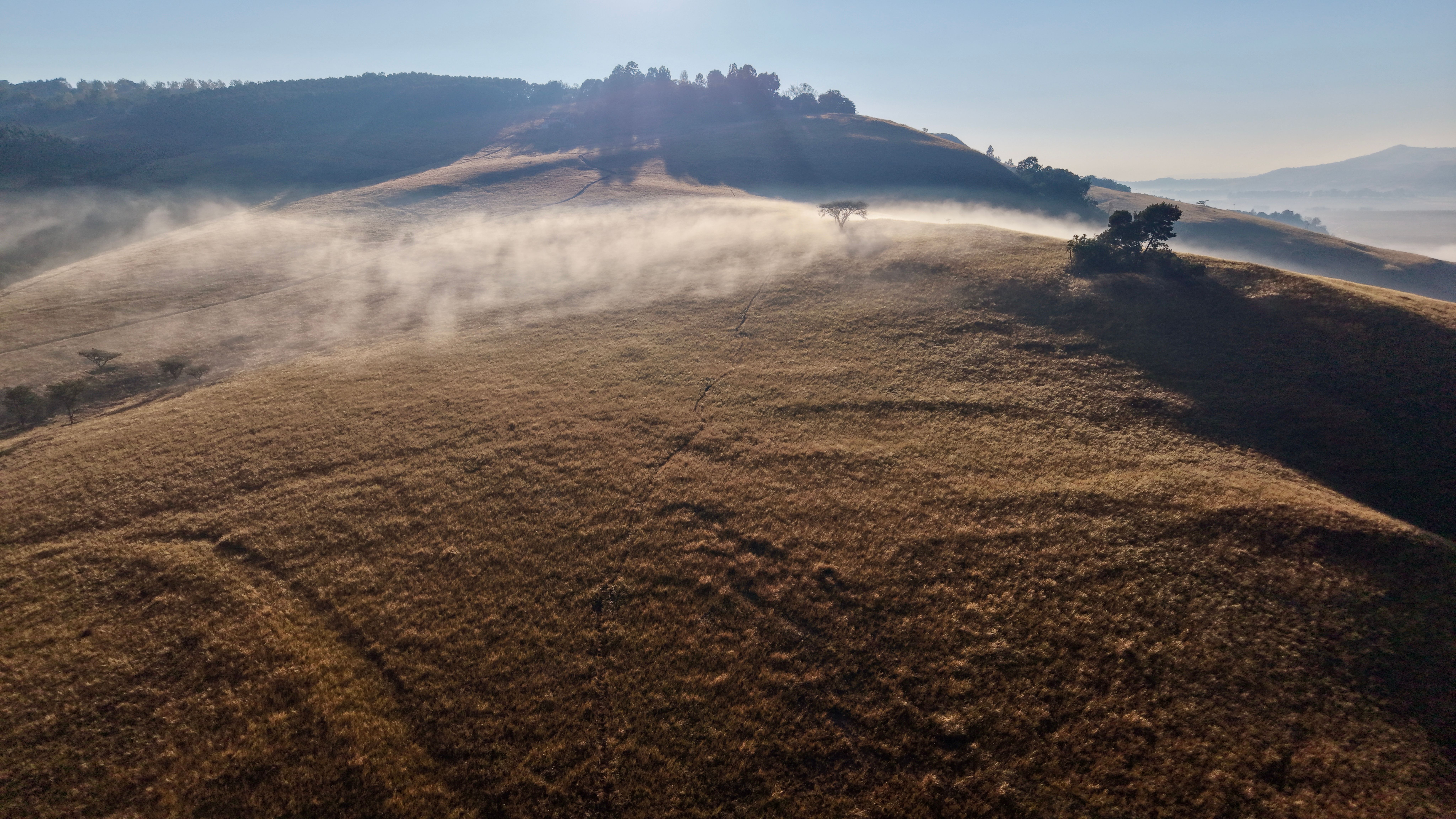Misty green hills in the KwaZulu-Natal Midlands at dawn