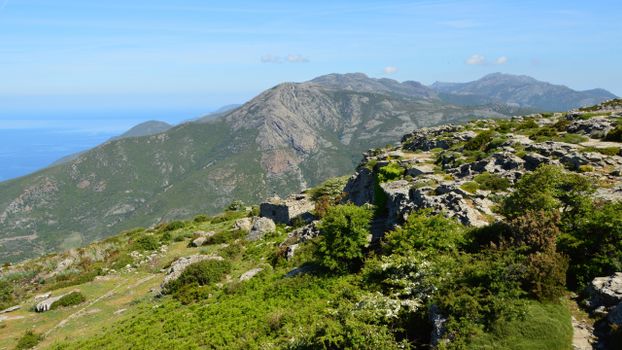 Beautiful mountainous landscape in Bastia, Corse, France under a clear blue sky.