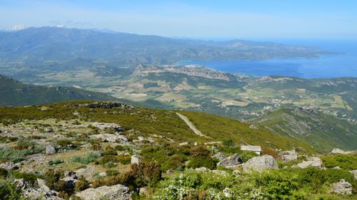 Free Stunning aerial view of Bastia, Corsica showcasing lush landscapes, mountains, and the blue Mediterranean Sea. Stock Photo