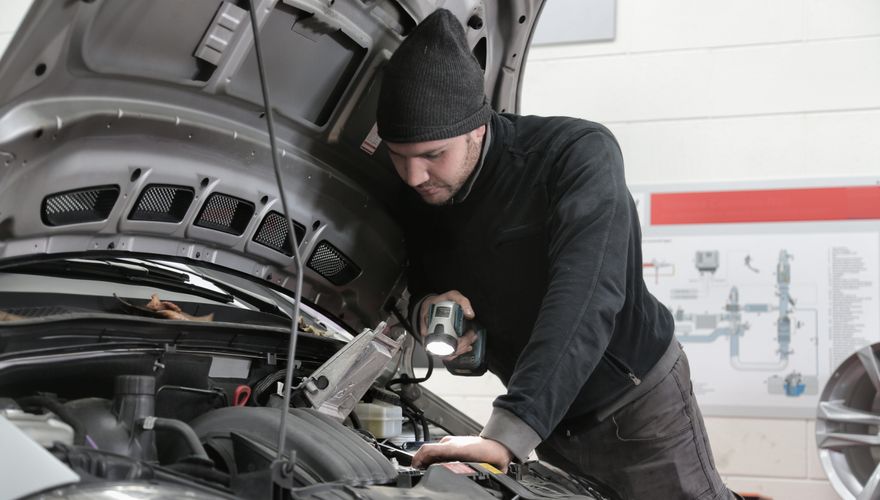 Car being serviced in a garage workshop