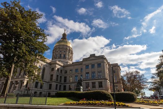 Historic Georgia State Capitol building under a bright blue sky in Atlanta.