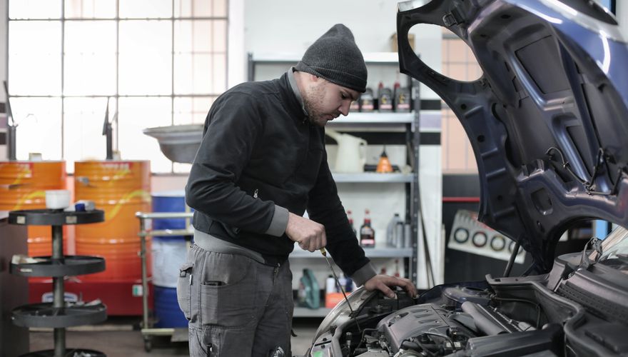Mechanic working on a car engine