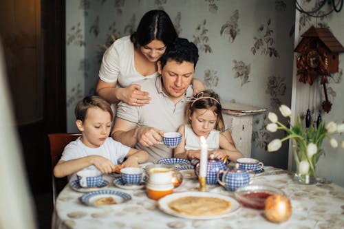 Free Family Sitting at Table Stock Photo