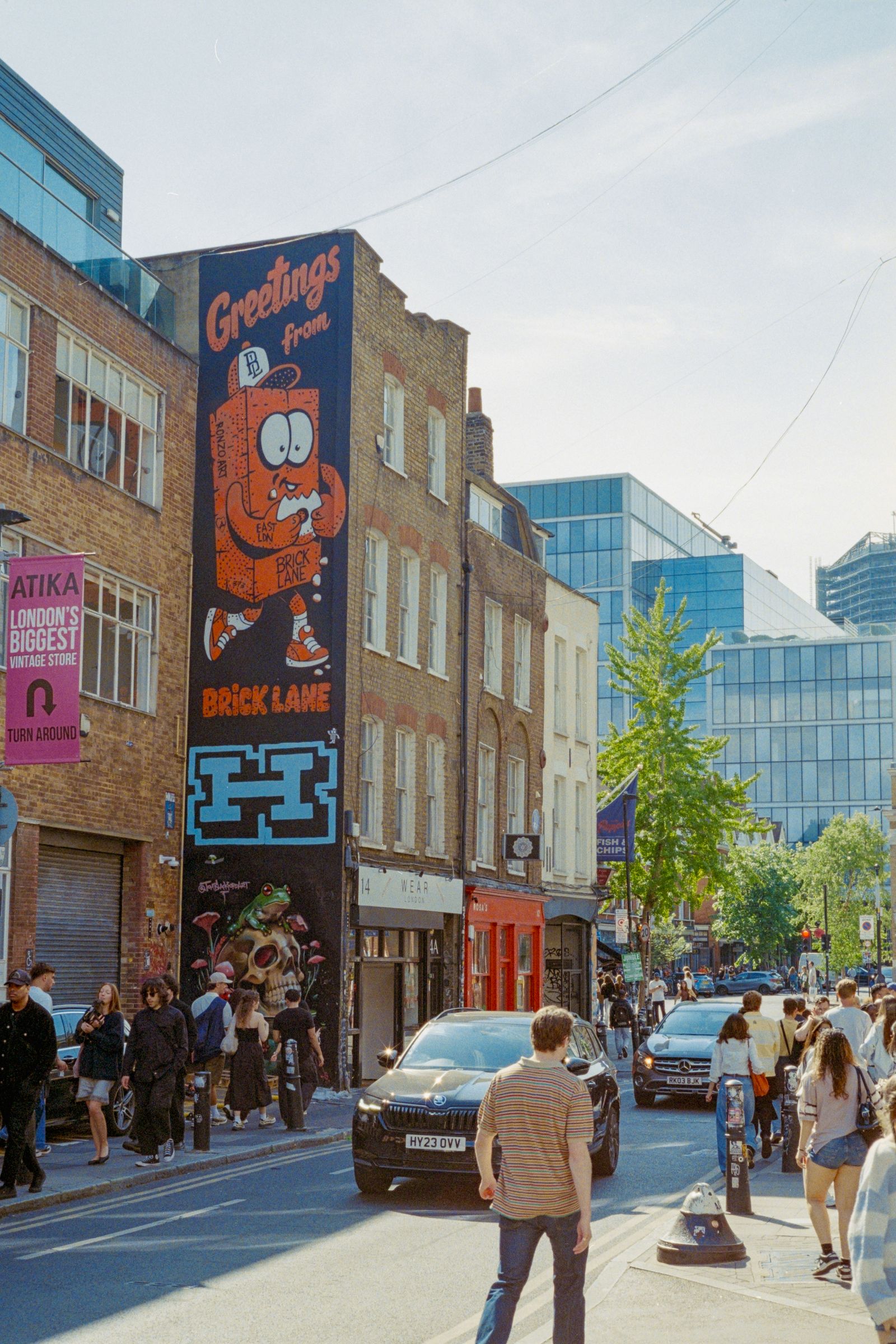 Colourful street art covering a wall along Brick Lane