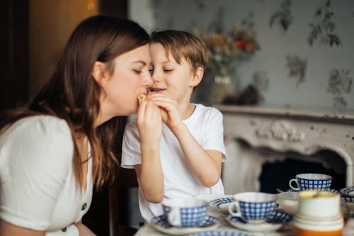 Free Photo of Boy Giving Food to His Mom Stock Photo