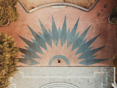 Creative aerial shot of a dancer in an artistic plaza setting in Rio Grande do Sul, Brazil.