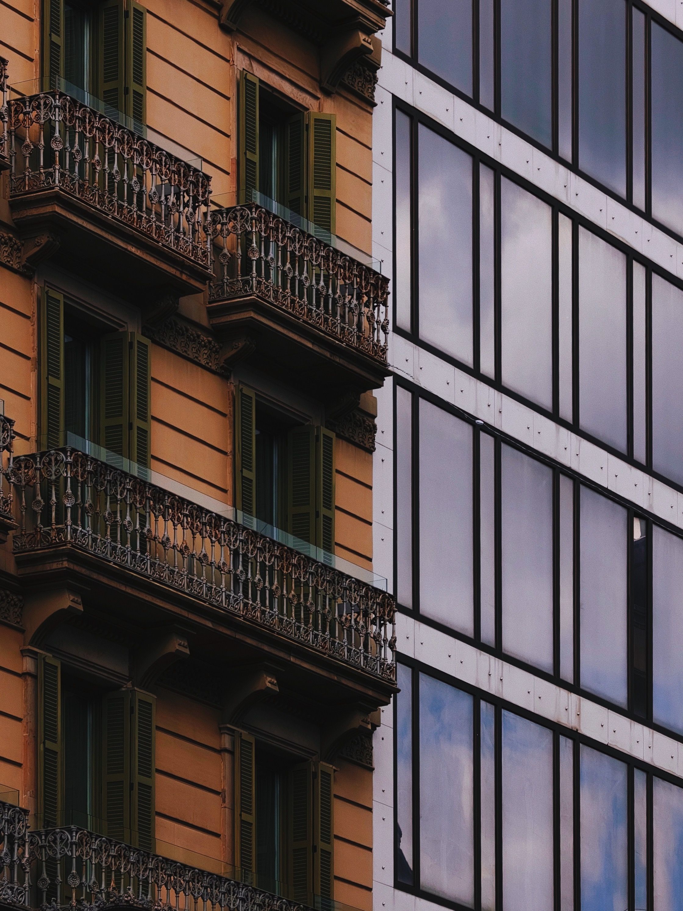 A close-up of historic and modern architecture in Barcelona, Spain.