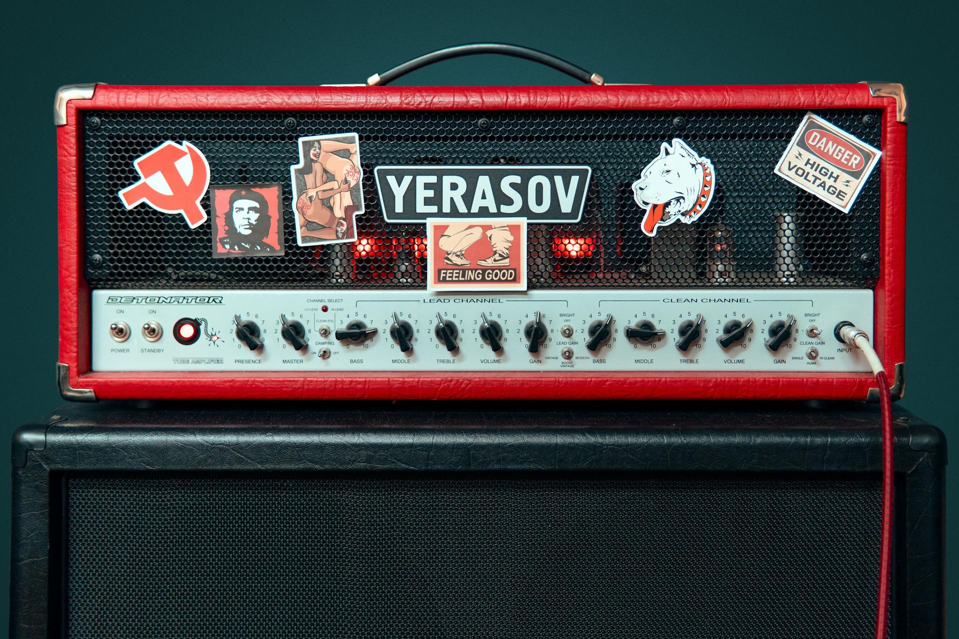 A close-up of a Yerasov amplifier with various stickers and controls.