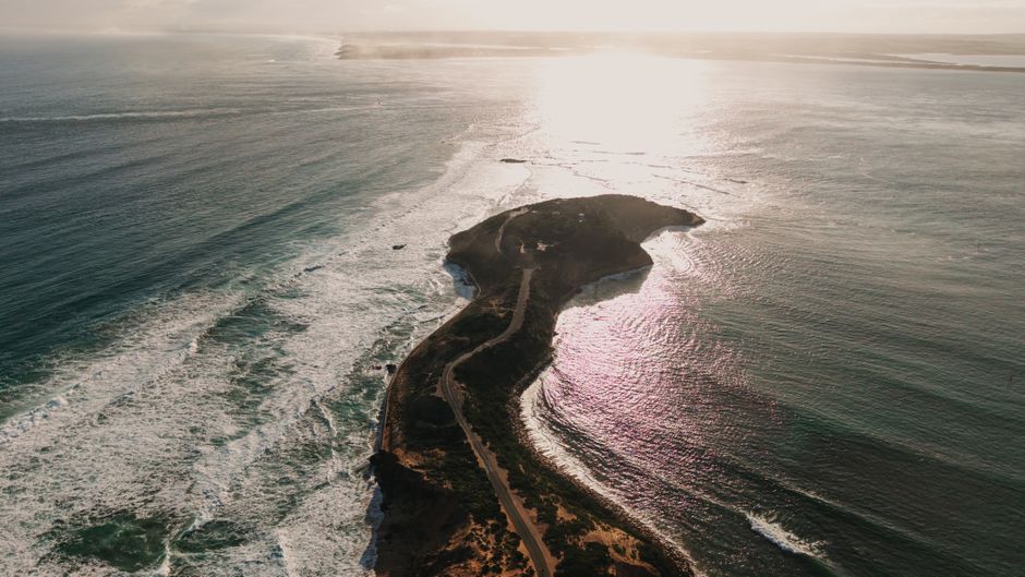 Unbeatable Chobe's Half-Day River Adventure: Where the Giants Come to Bathe Review Review 2026 - Breathtaking aerial view of a coastal peninsula in Portsea, Australia, during sunset.