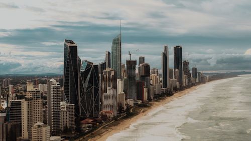 Free Aerial shot of Gold Coast's skyline with modern skyscrapers along the coastline. Stock Photo