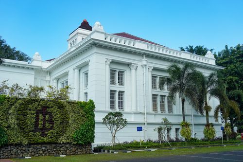 Free Elegant colonial-style building in Bandung, West Java, with lush greenery. Stock Photo