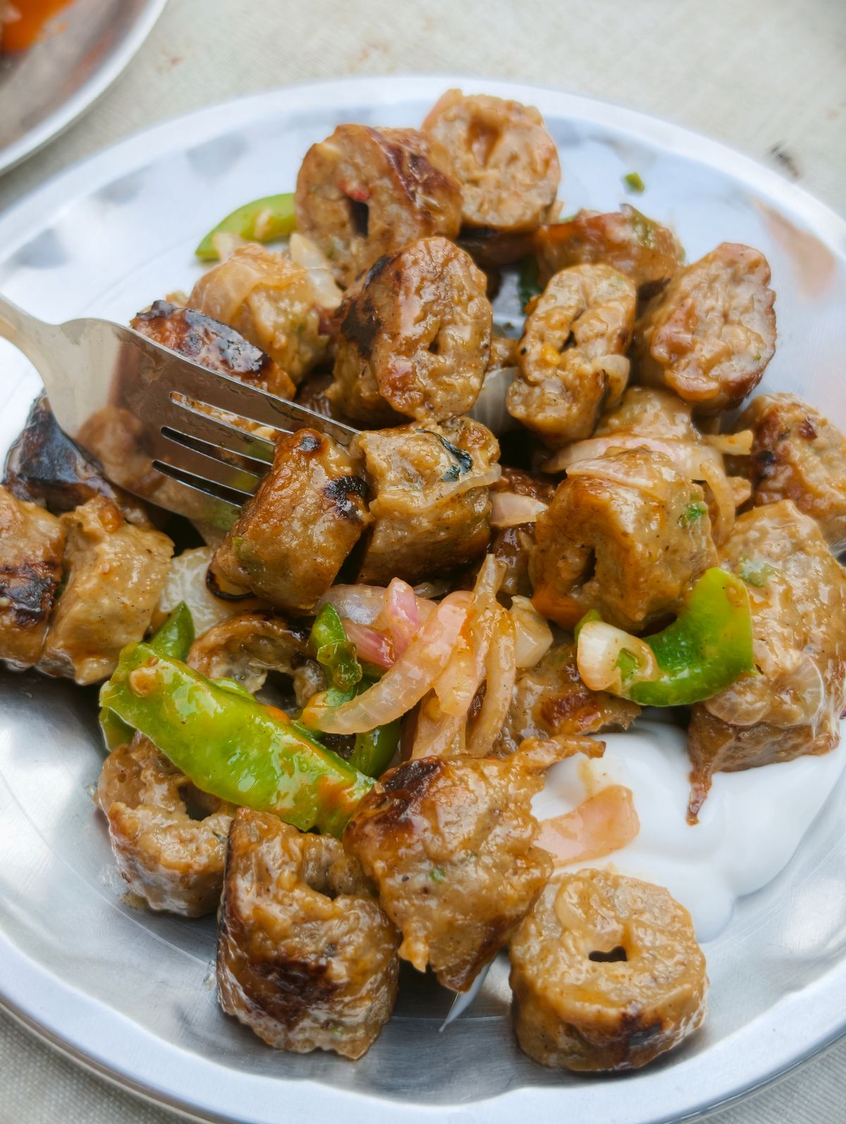 Sausage and peppers cooked together on a pan