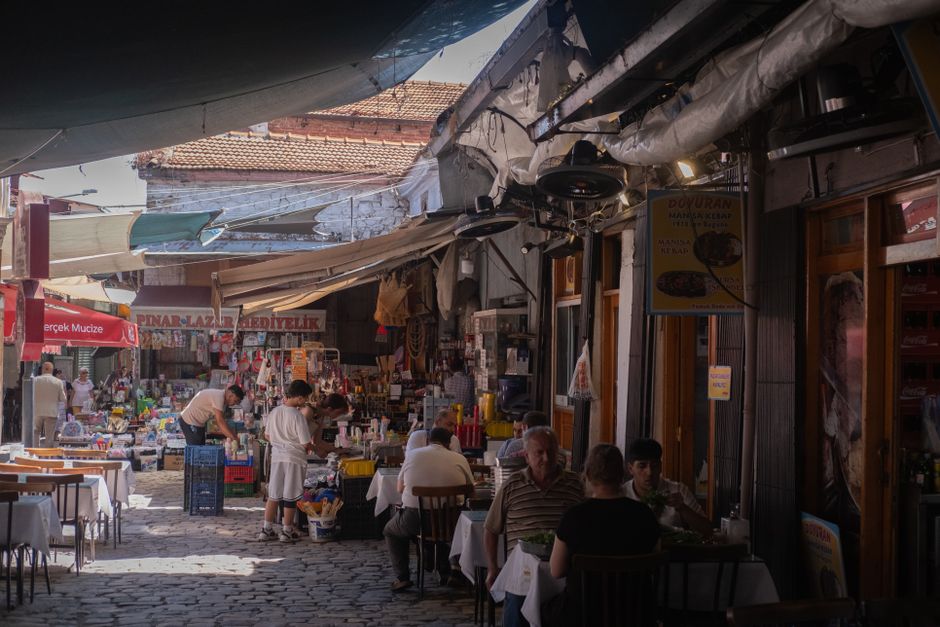 Vibrant street scene in Skopje Old Bazaar, North Macedonia, reminding travelers to secure their trip with insurance.