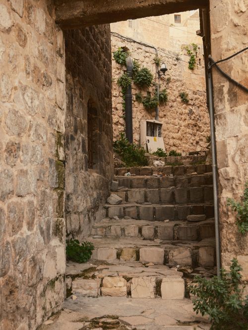 Free Explore a traditional stone alleyway in the ancient city of Mardin, Turkey, showcasing its unique architectural style. Stock Photo