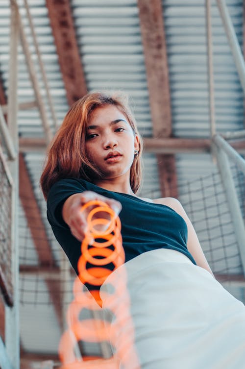 Cool teen girl with spring toy