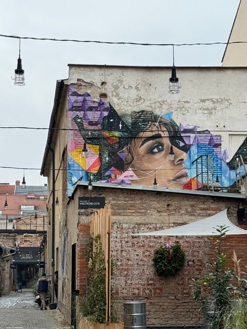Free Colorful mural on a building in a Prague alley, showcasing urban street art. Stock Photo