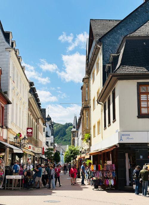 Free A bustling street in Boppard, Germany, showcasing vibrant shops and historic architecture. Stock Photo