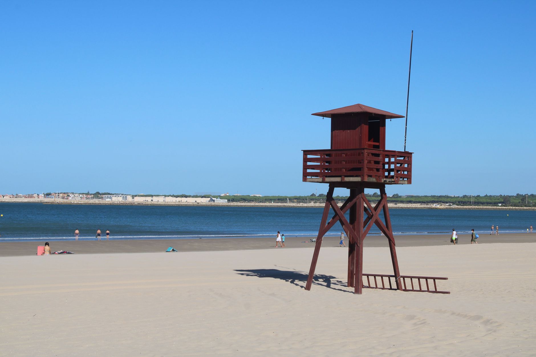 ras el hekma beach party planner — Lifeguard tower on a sandy beach in El Puerto de Santa María, Spain.
