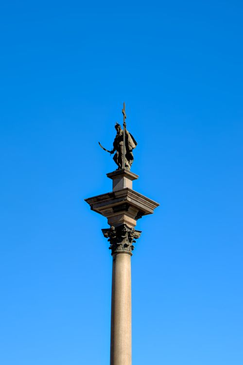 Free Sigismund's Column in Warsaw, Poland, a historic monument against a clear blue sky. Stock Photo
