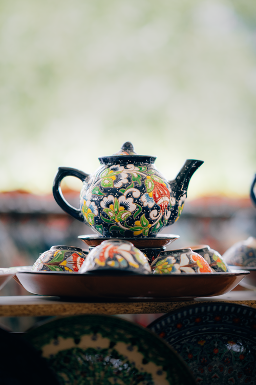 Free A vibrant ceramic teapot with colorful floral patterns from Samarqand, Uzbekistan. Stock Photo