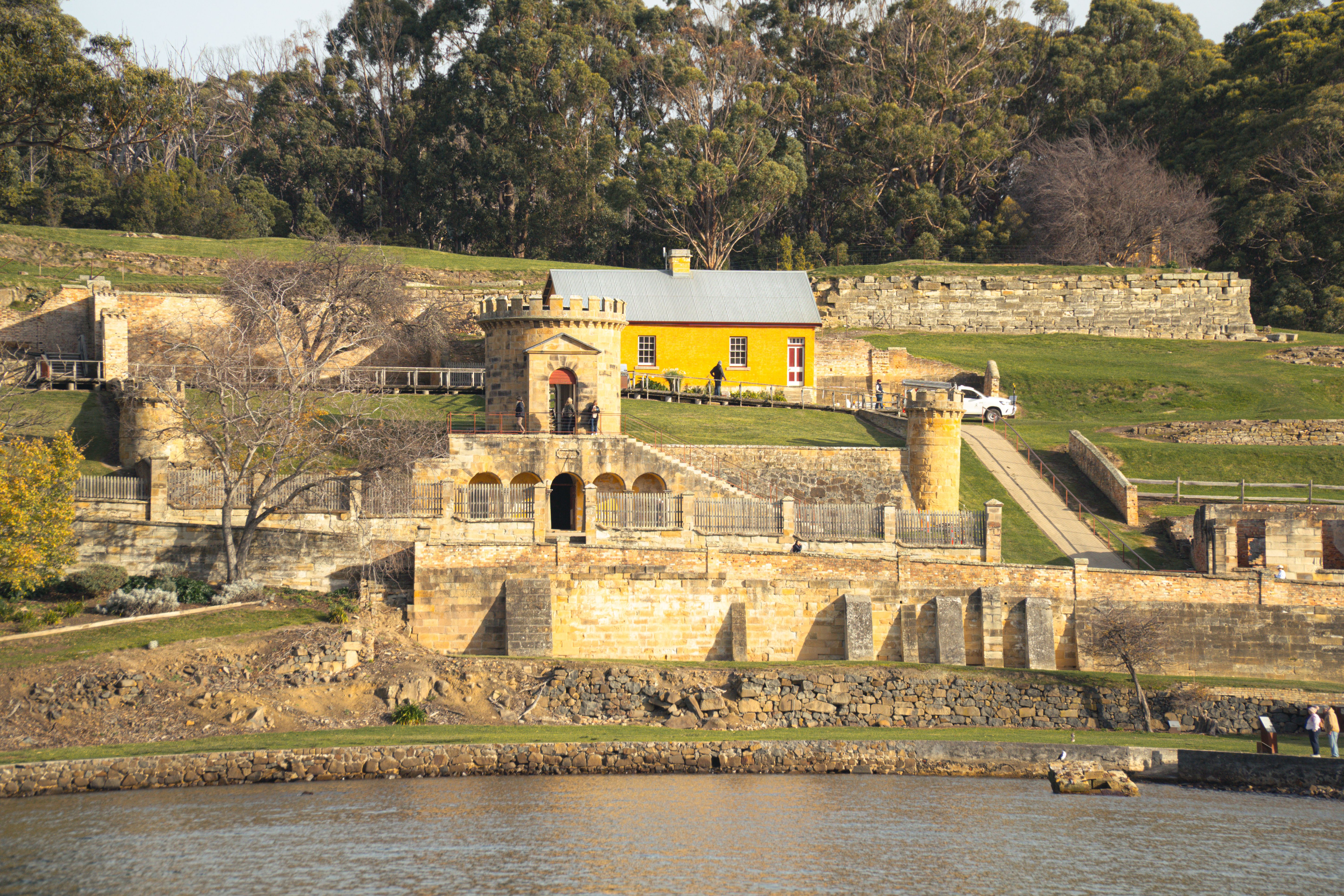 Explore the historic Port Arthur Penal Colony, showcasing stunning architecture and lush surroundings in Tasmania, Australia.