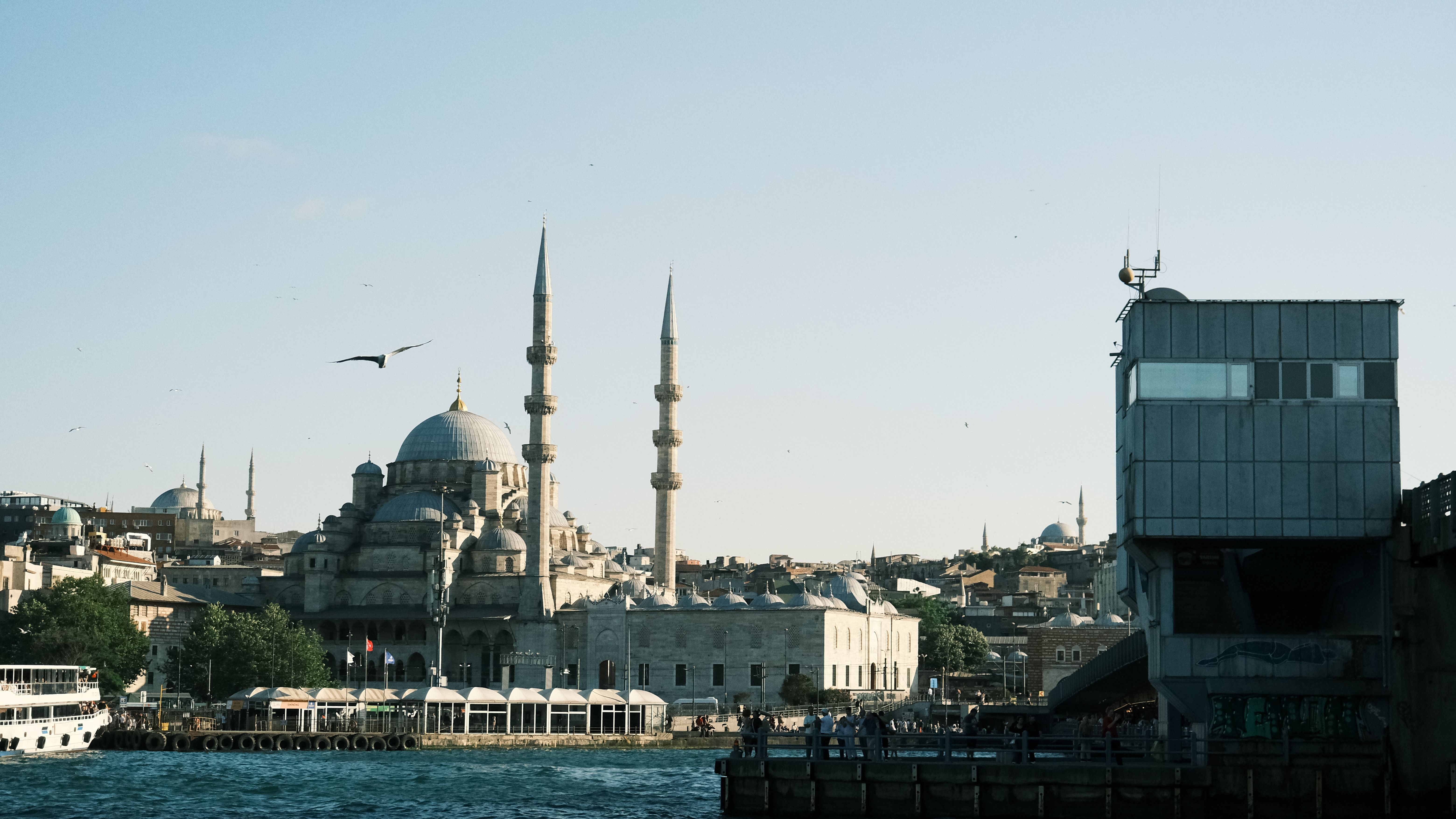 Beautiful daytime view of the Yeni Cami Mosque and surrounding architecture in Istanbul, Turkey.