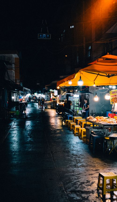 Free Explore the bustling night market in Ho Chi Minh City with vivid lights and street food stalls. Stock Photo