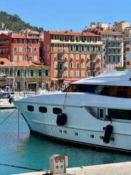 Elegant yacht in the scenic and colorful port of Nice, France on a sunny day.
