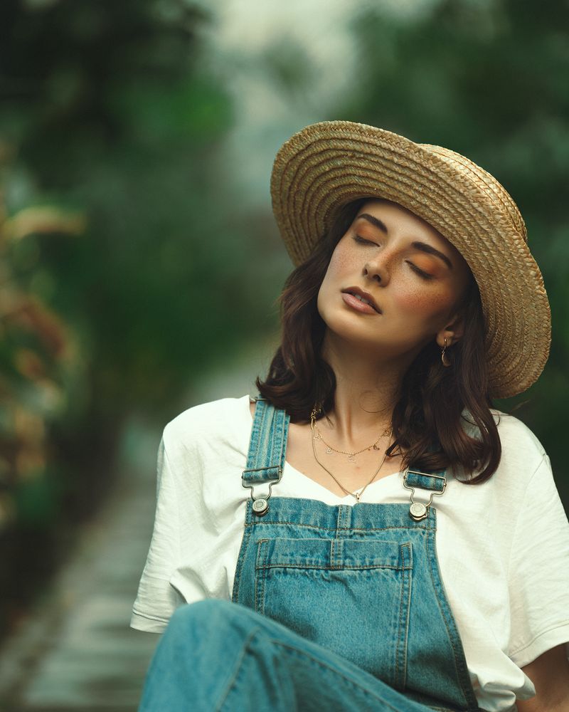 Woman wearing denim overalls with a cute top