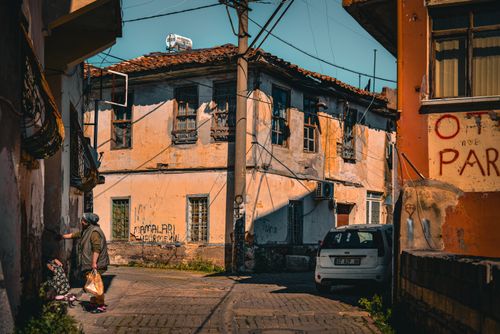 Free A serene view of an antique street in Antalya, Türkiye with historic buildings and local life. Stock Photo