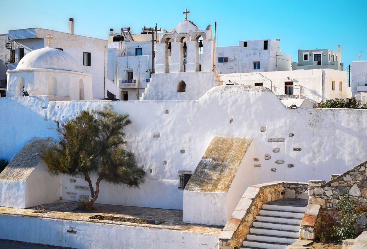 Beautiful white Orthodox church architecture in the quaint town of Naxos, Greece.