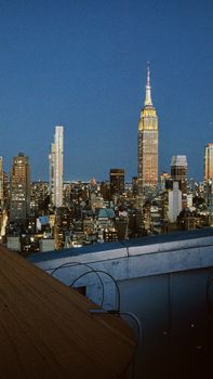 Stunning New York City skyline featuring the iconic Empire State Building at dusk.