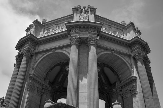 Detailed view of grand neoclassical columns and arches at the Palace of Fine Arts in San Francisco.