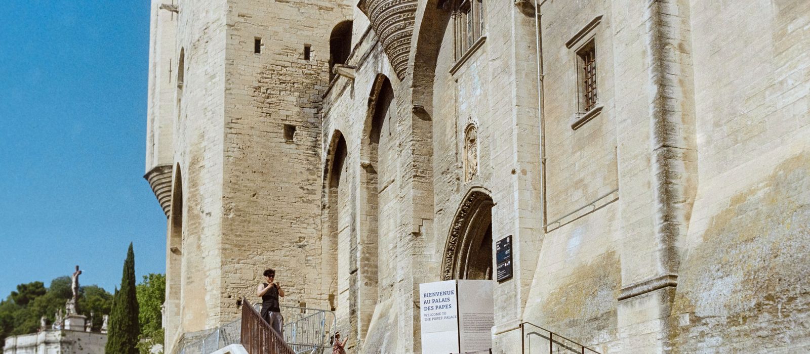 View of the historic Palace of the Popes in Avignon, showcasing medieval architecture.