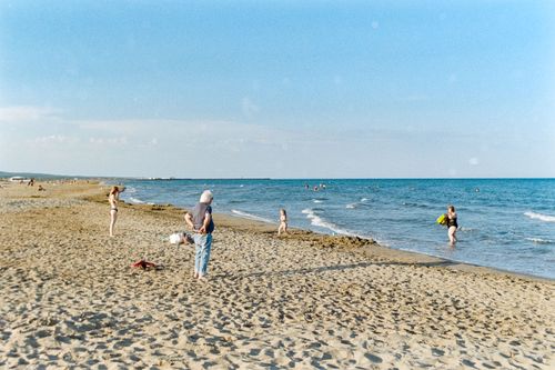 Free People enjoying a sunny day on the sandy beach in Gruissan, Occitanie, France. Stock Photo