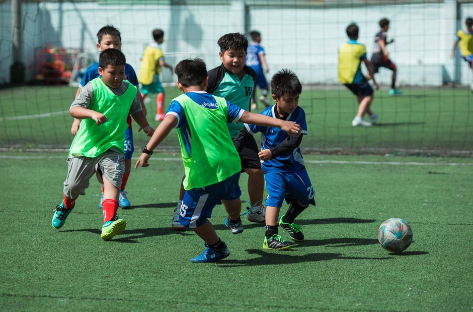 Photo by Thái Trường Giang on Pexels Kids engaging in a soccer match on a sunny day, showcasing teamwork and energy in Vietnam. - Photo by Thái Trường Giang on Pexels
