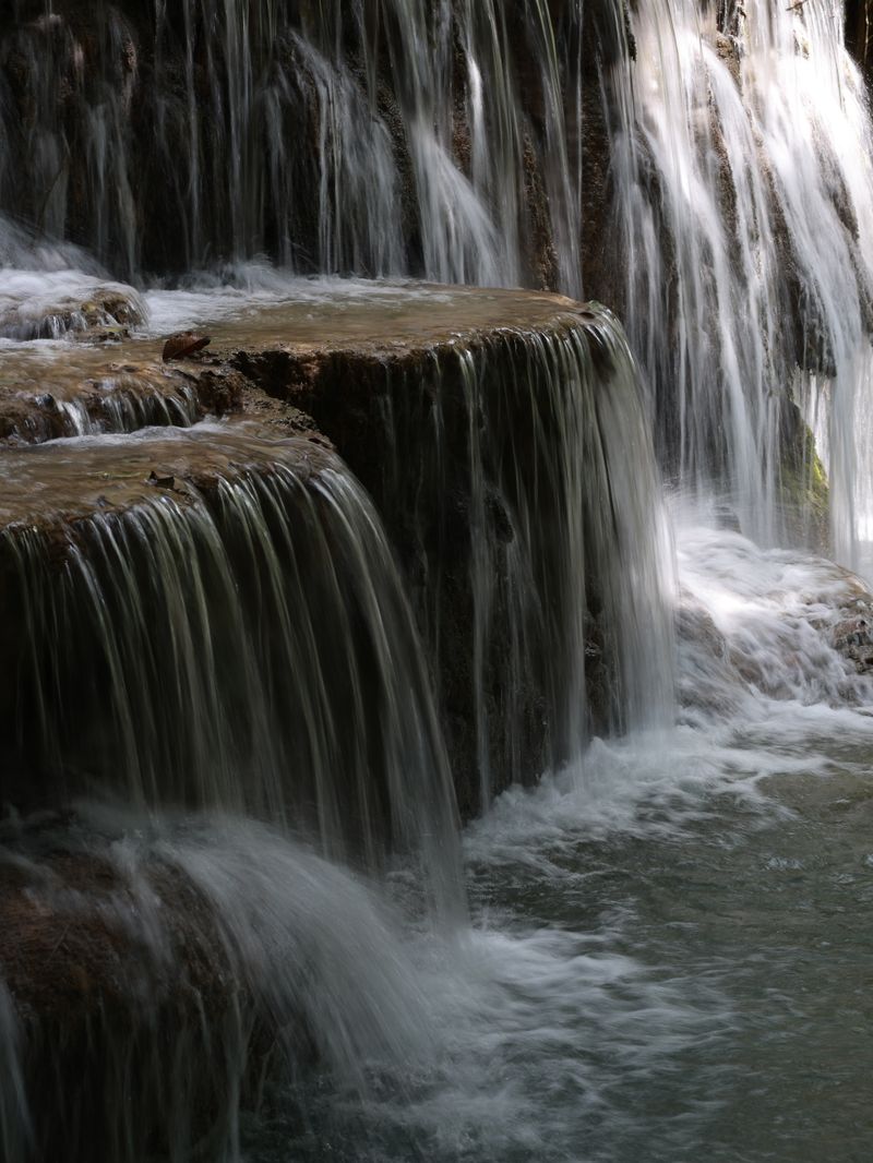 Tiered cascades of Kuang Si Falls near Luang Prabang