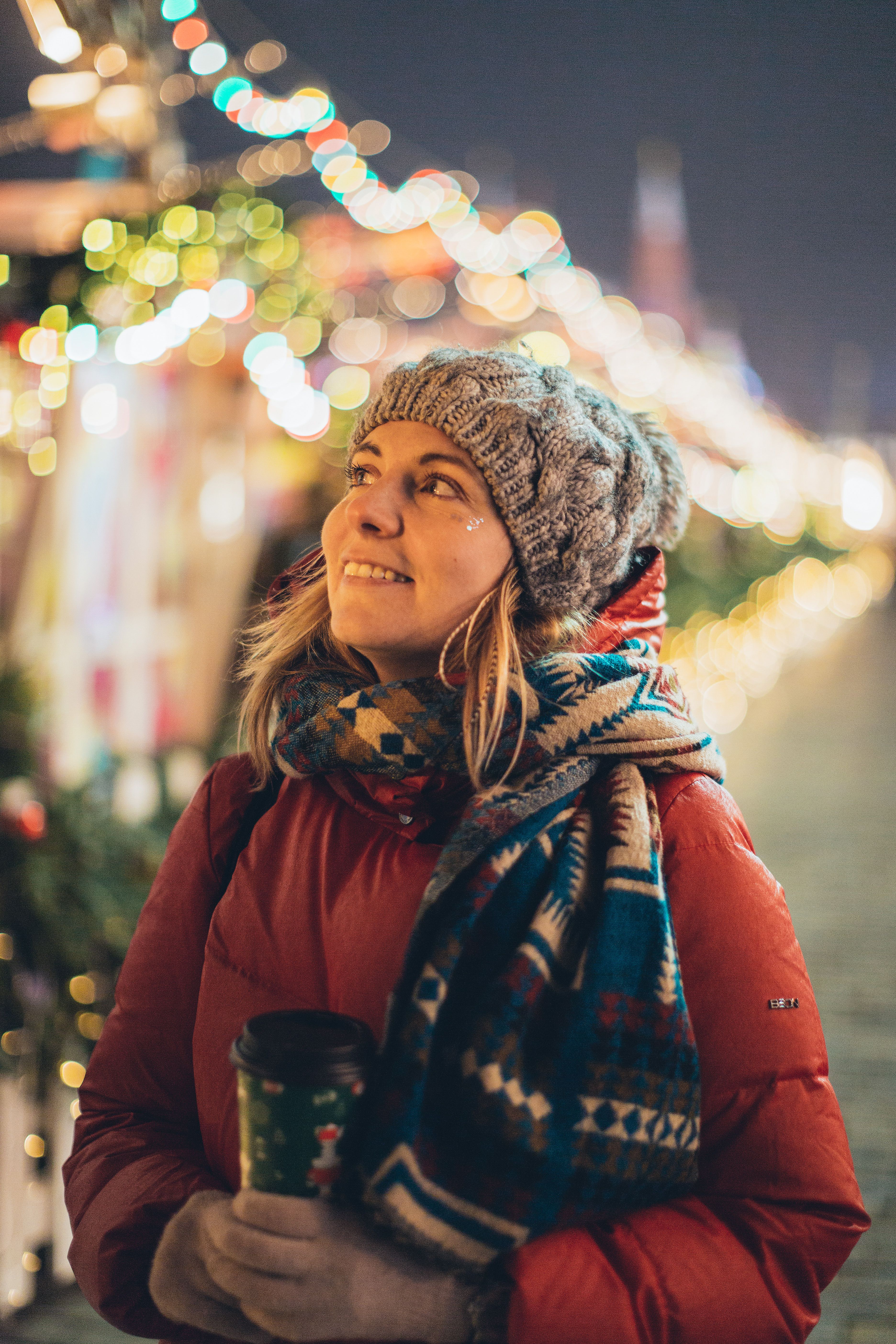 Woman in Red Jacket Holding Disposable Cup · Free Stock Photo