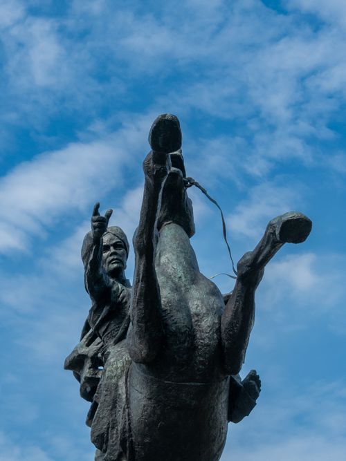 Free Iconic monument of a leader on horseback against a clear blue sky in Jakarta, Indonesia. Stock Photo