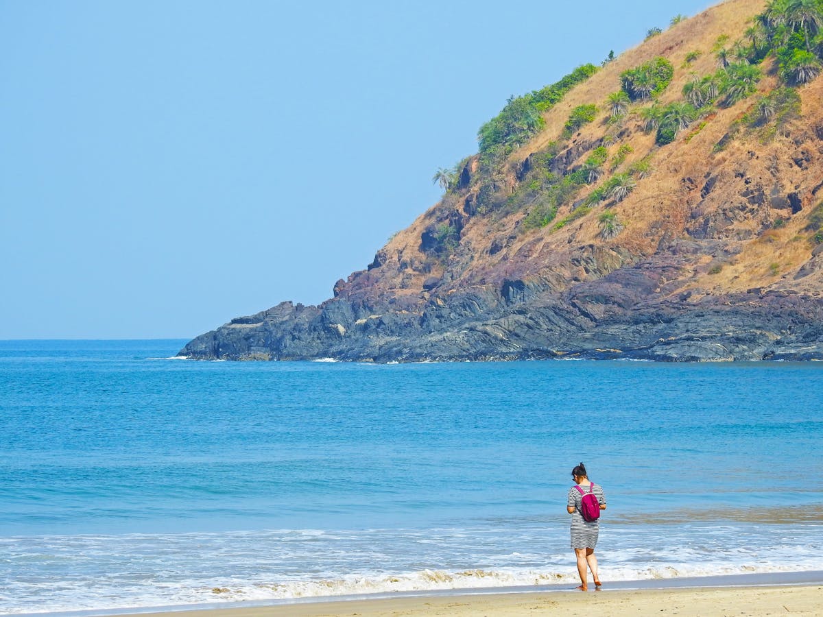 Silhouettes of two athletes facing off under arena lights
