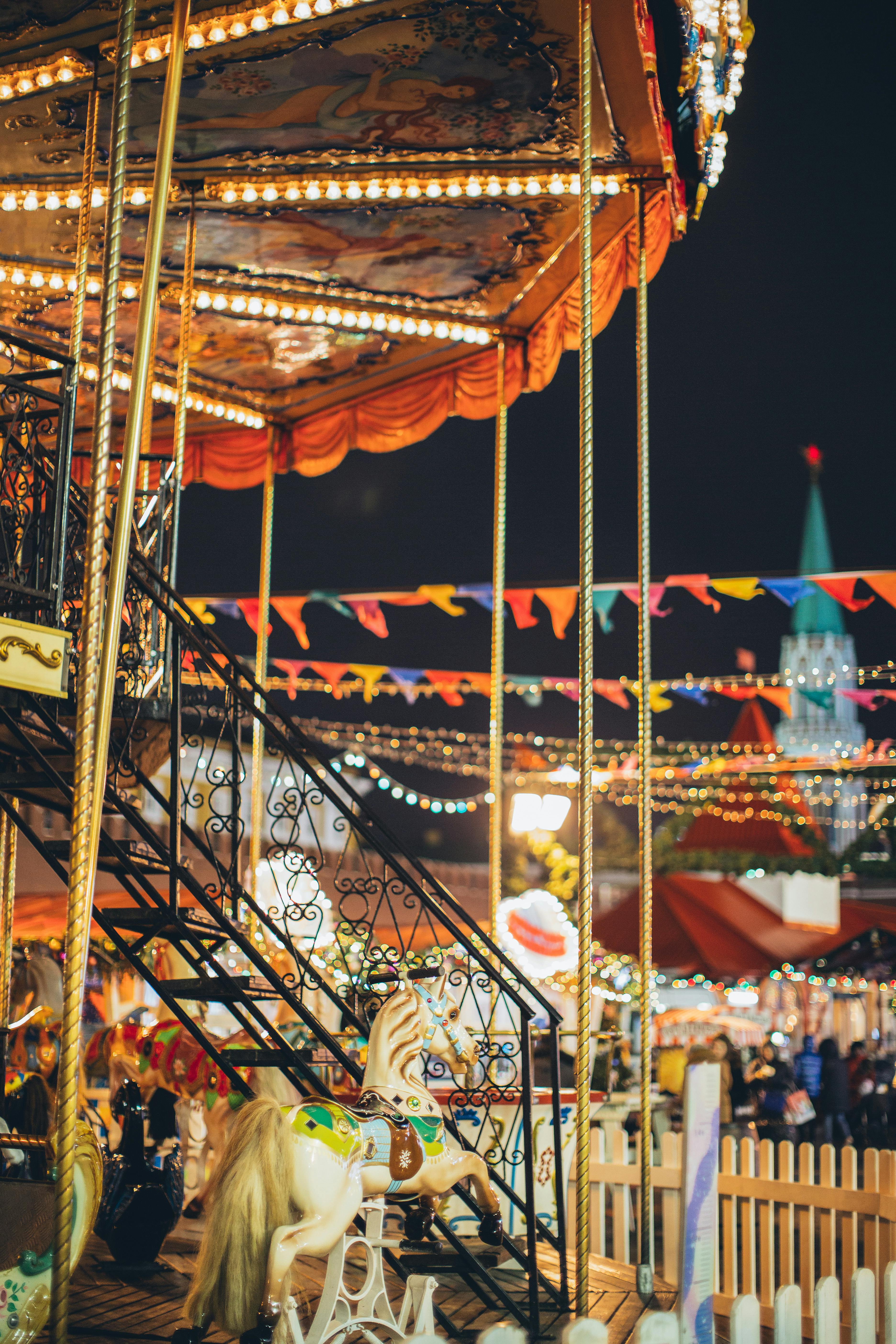 colorful carousel in amusement park at night