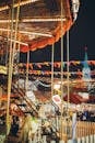 Colorful carousel in amusement park at night