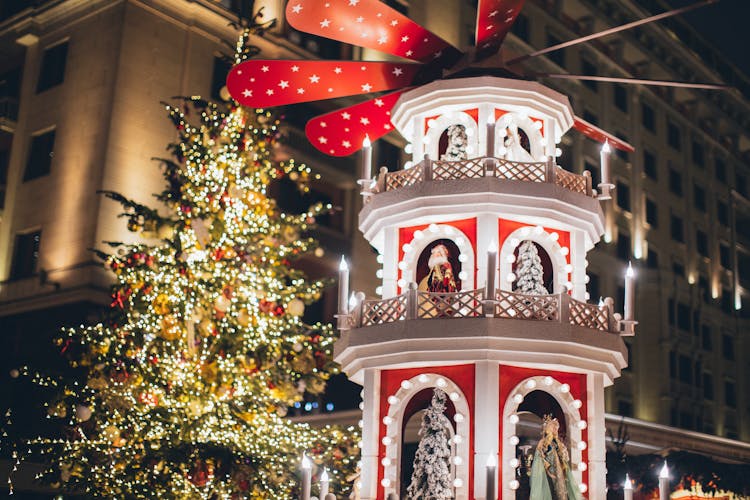 Illuminated Christmas Tree And Decoration In Night City