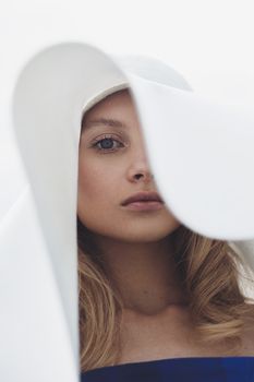 Stunning portrait of a woman with a white hat, captured in Zakopane, Poland.