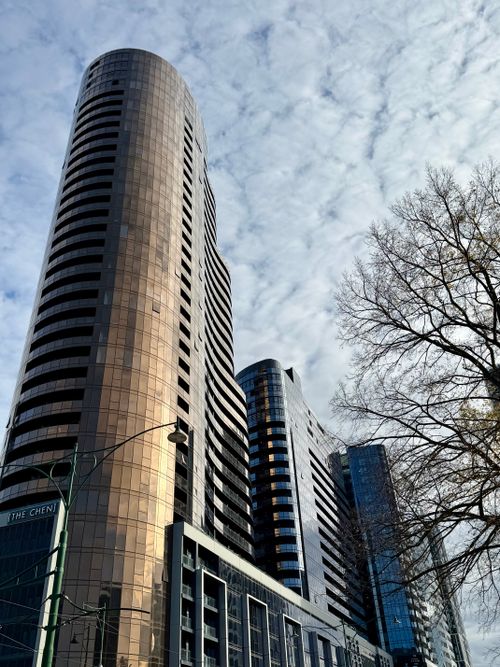 Free Skyward view of towering skyscrapers in Box Hill with a clear sky backdrop. Stock Photo