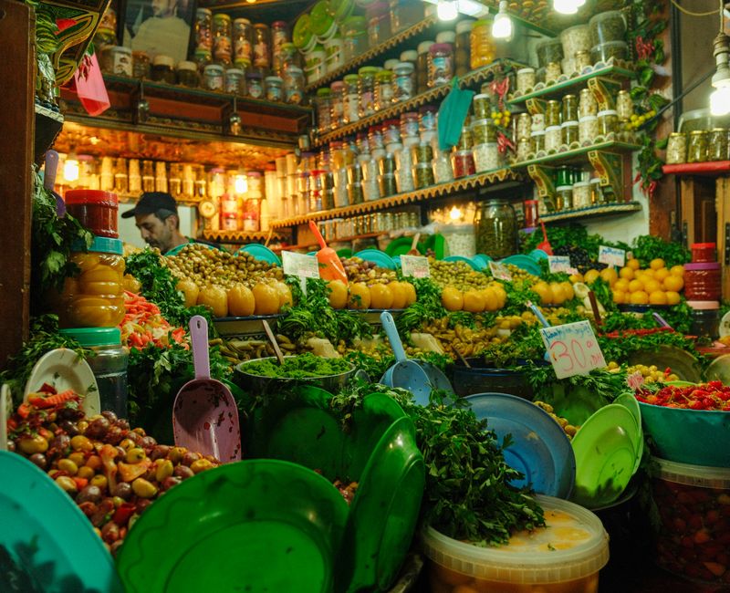A vibrant display of seasonal Moroccan vegetables and spices