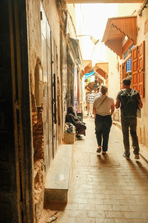Free A bustling alleyway in Fes Medina, Morocco, capturing daily life and vibrant architecture. Stock Photo