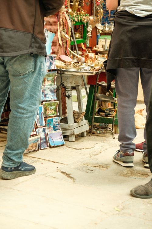 Free Vibrant local market in Fes with shoppers browsing colorful stalls and souvenirs. Stock Photo
