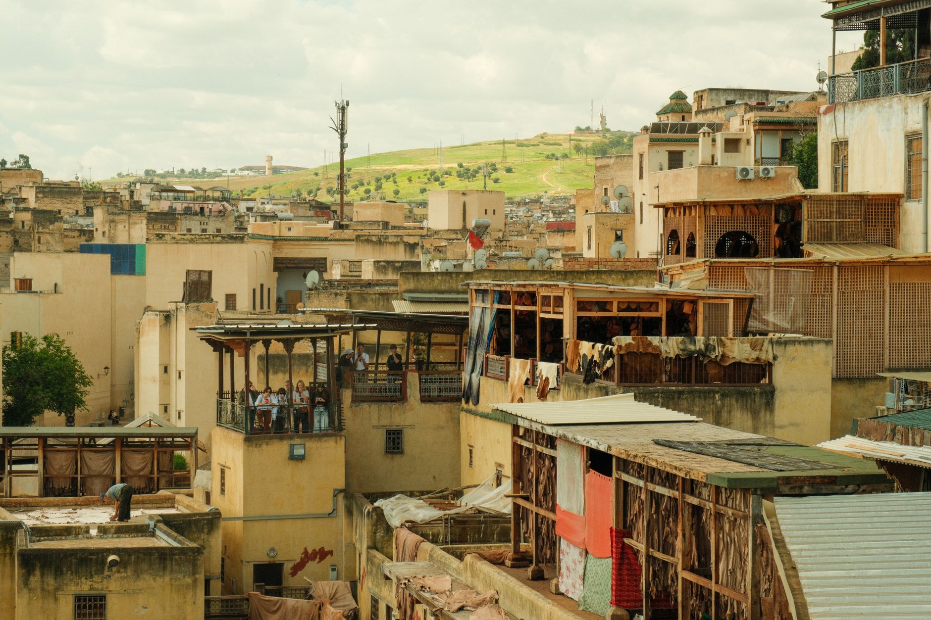 A captivating view over the rooftops of Fes, showcasing traditional Moroccan architecture and vibrant city life.
