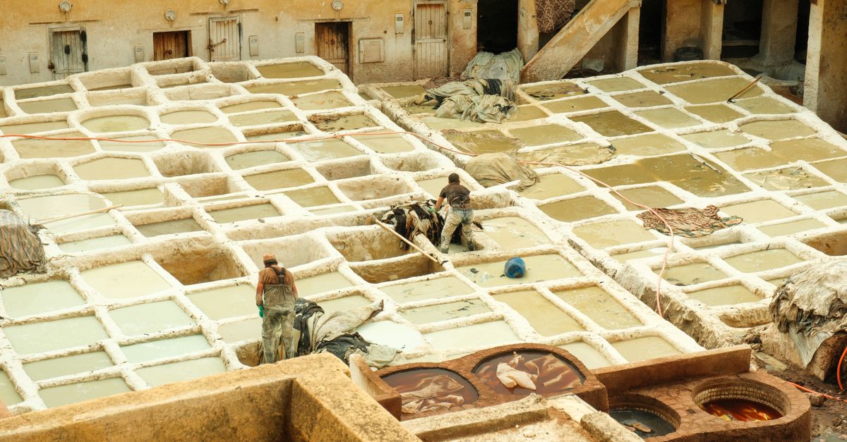 Traditional leather tanneries of Fes, Morocco — multicolored dye vats seen from above, a highlight of the Fes medina guided tour included in the 7 days from Marrakech itinerary